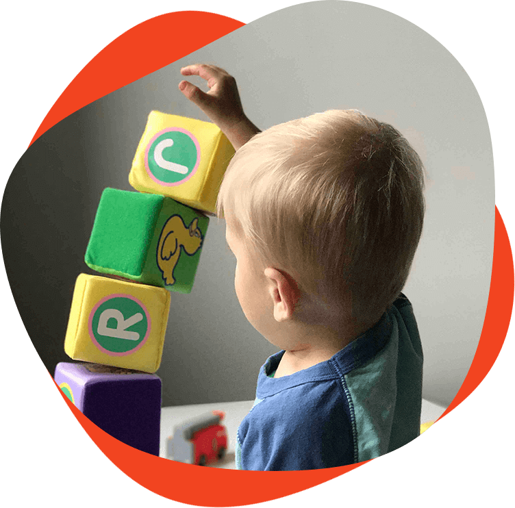 Young Child Stacking Blocks